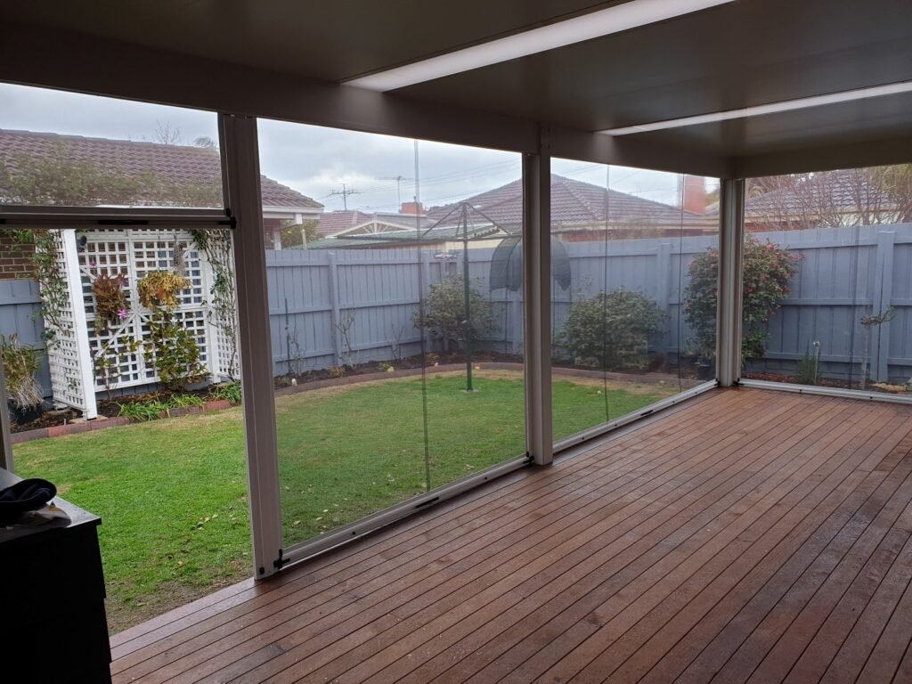 Ziptrak blinds fitted around a covered outdoor pergola.