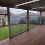 Ziptrak blinds fitted around a covered outdoor pergola.